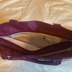 Small silky like purple purse.